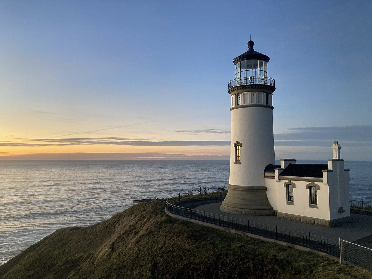 North Head Lighthouse on its bluff at sunset