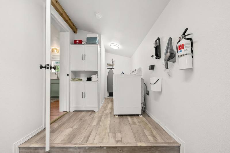 The mud room with washer, dryer and fire extinguisher